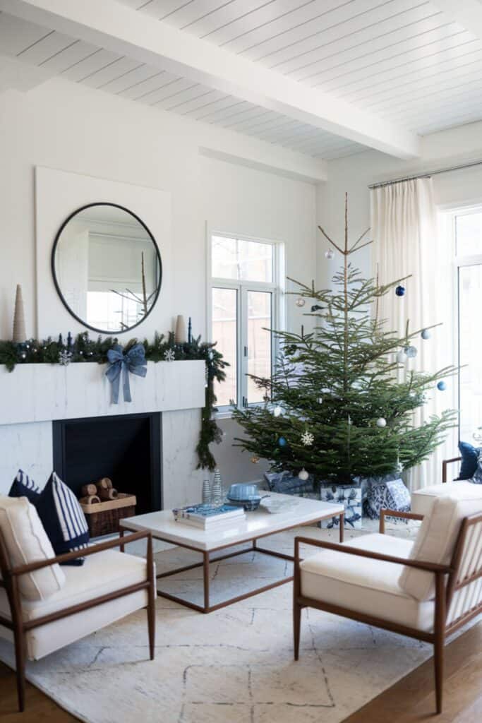 A modern living room for Christmas with blue and silver decorations