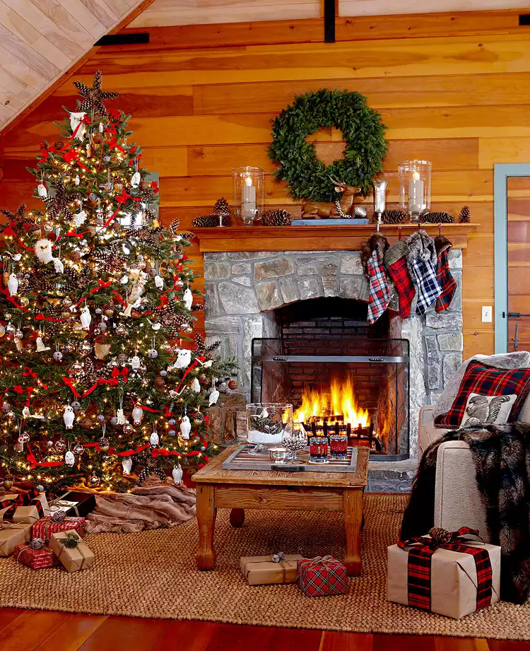 Living room with large Christmas tree and fireplace