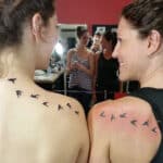 Mother and Daughter Shoulder Tattoos with Flying Birds Design