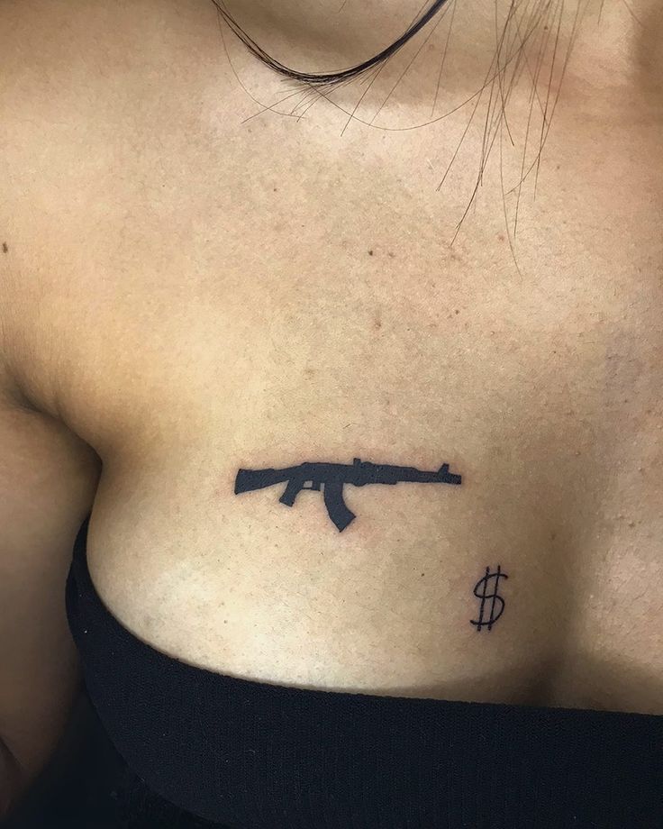 Gun tattoo idea for women