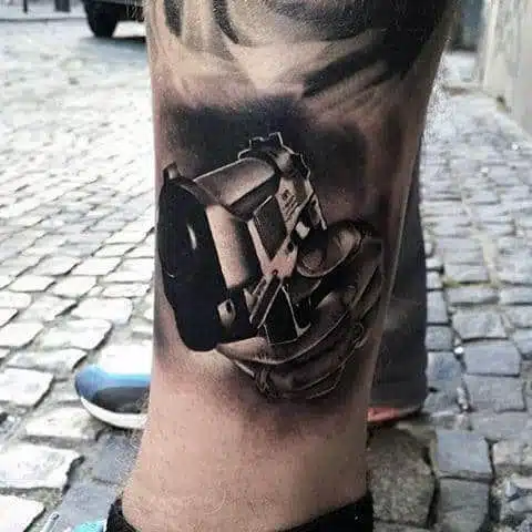 Gun tattoo idea on leg