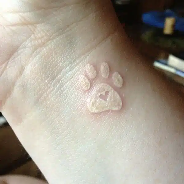 white pet tattoo idea for women