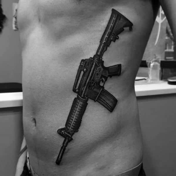 Gun tattoo idea on Chest