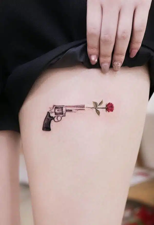 Simple Gun tattoo idea for women