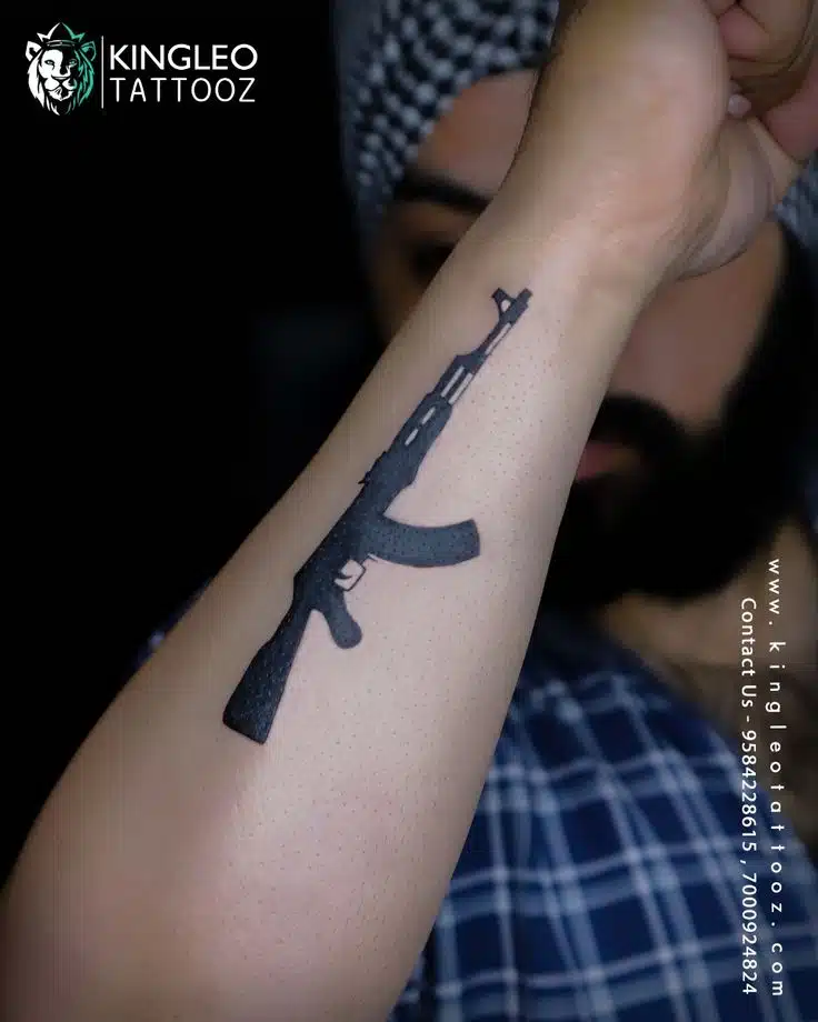 Gun tattoo idea on arm