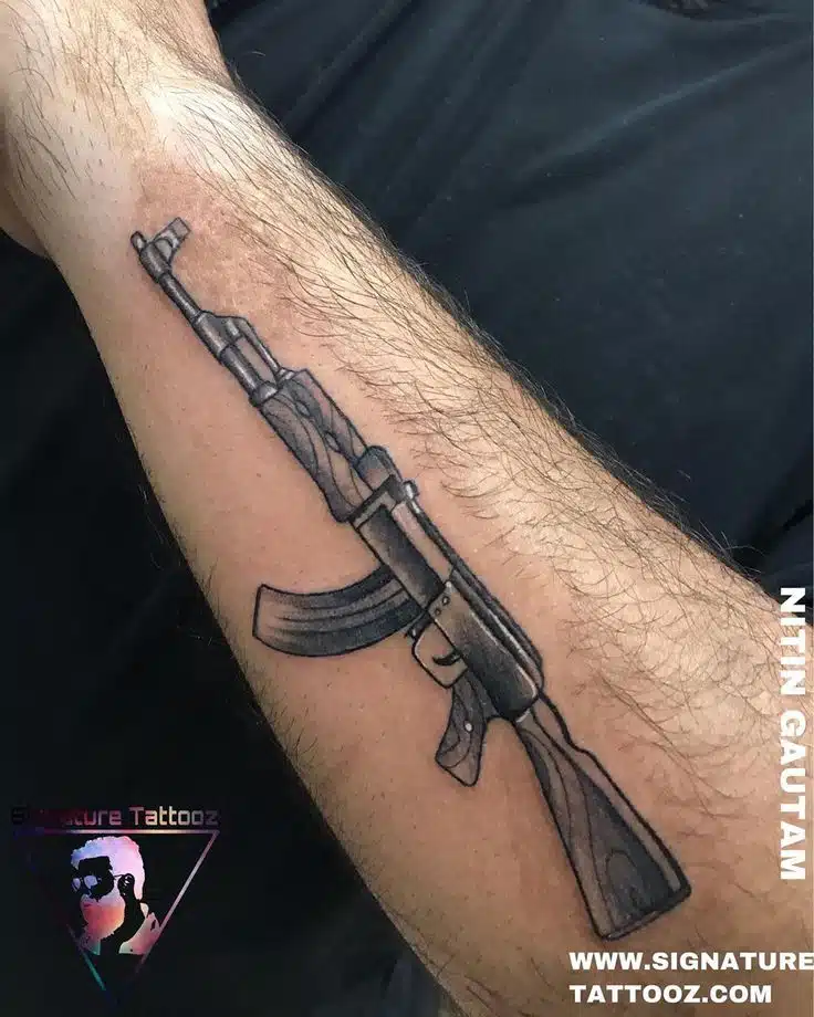 Gun tattoo idea on Arm