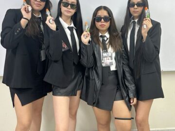 Go Bold with a Men in Black Costume Theme for Your Girl Group