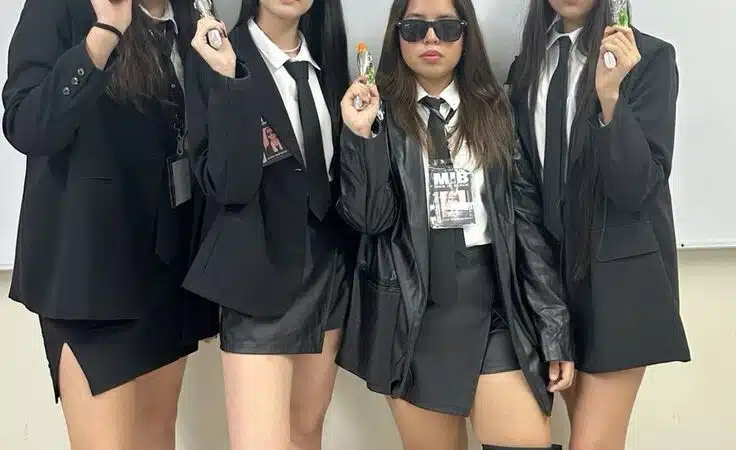 Go Bold with a Men in Black Costume Theme for Your Girl Group