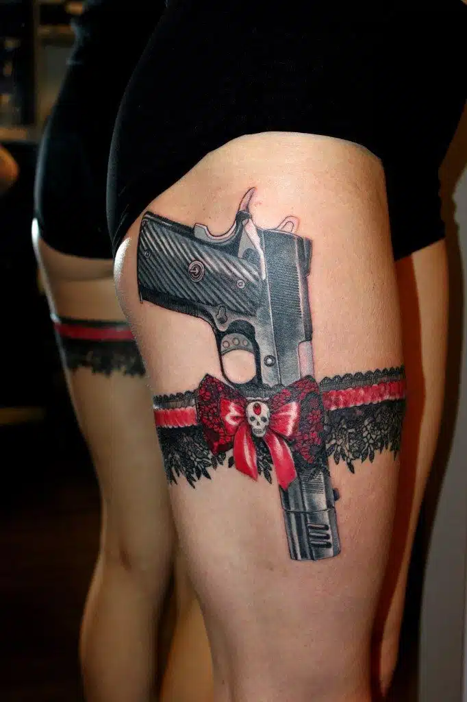 Gun tattoo idea for women