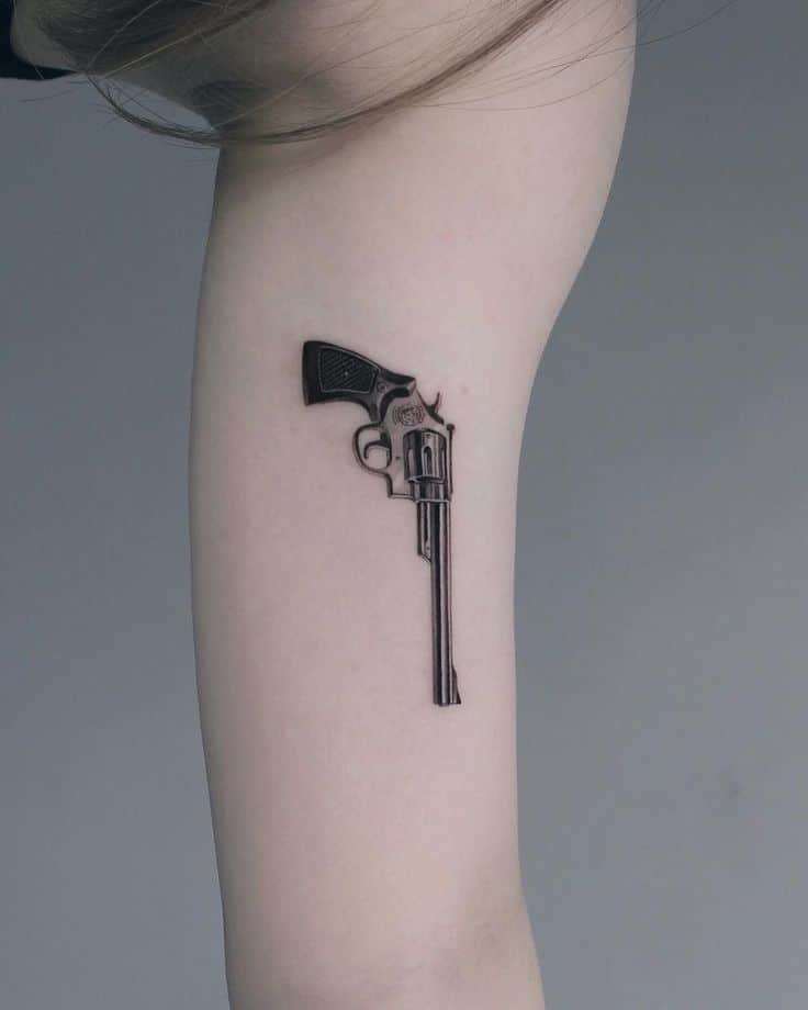 Gun tattoo idea for women