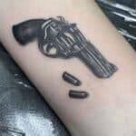 Fierce Ink: Unleashing the Bold Beauty and Meaning Behind Gun Tattoos