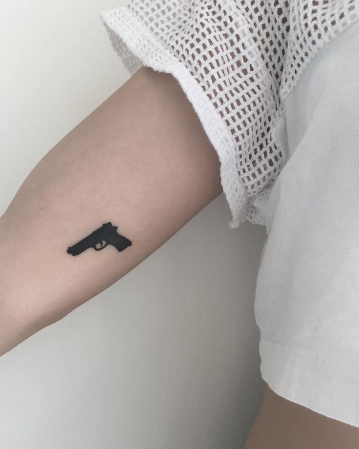 Gun tattoo idea for women