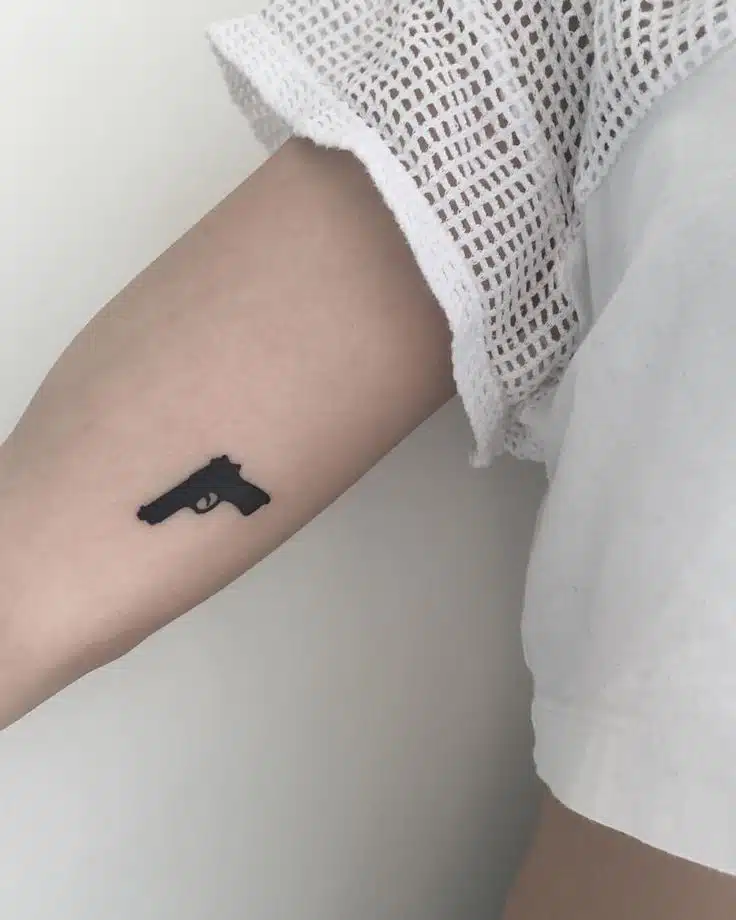 Gun tattoo idea for women