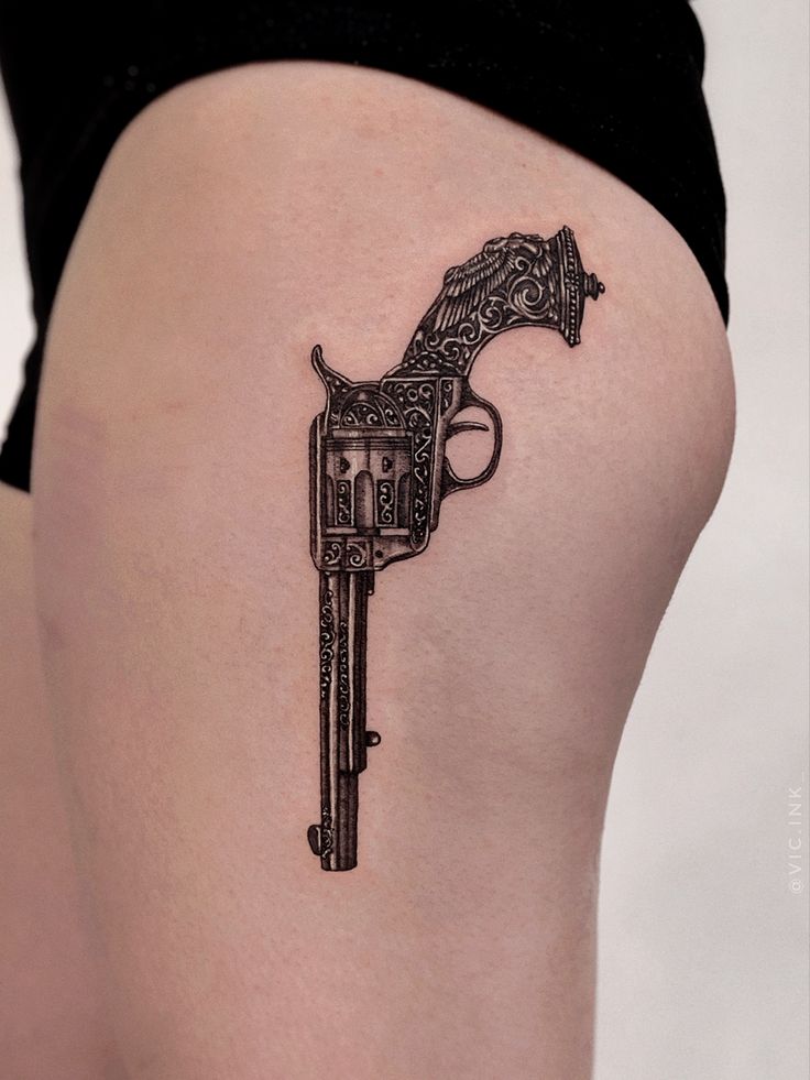 Gun tattoo idea for women
