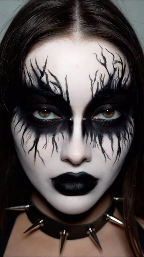 Black pencil art makeup on face