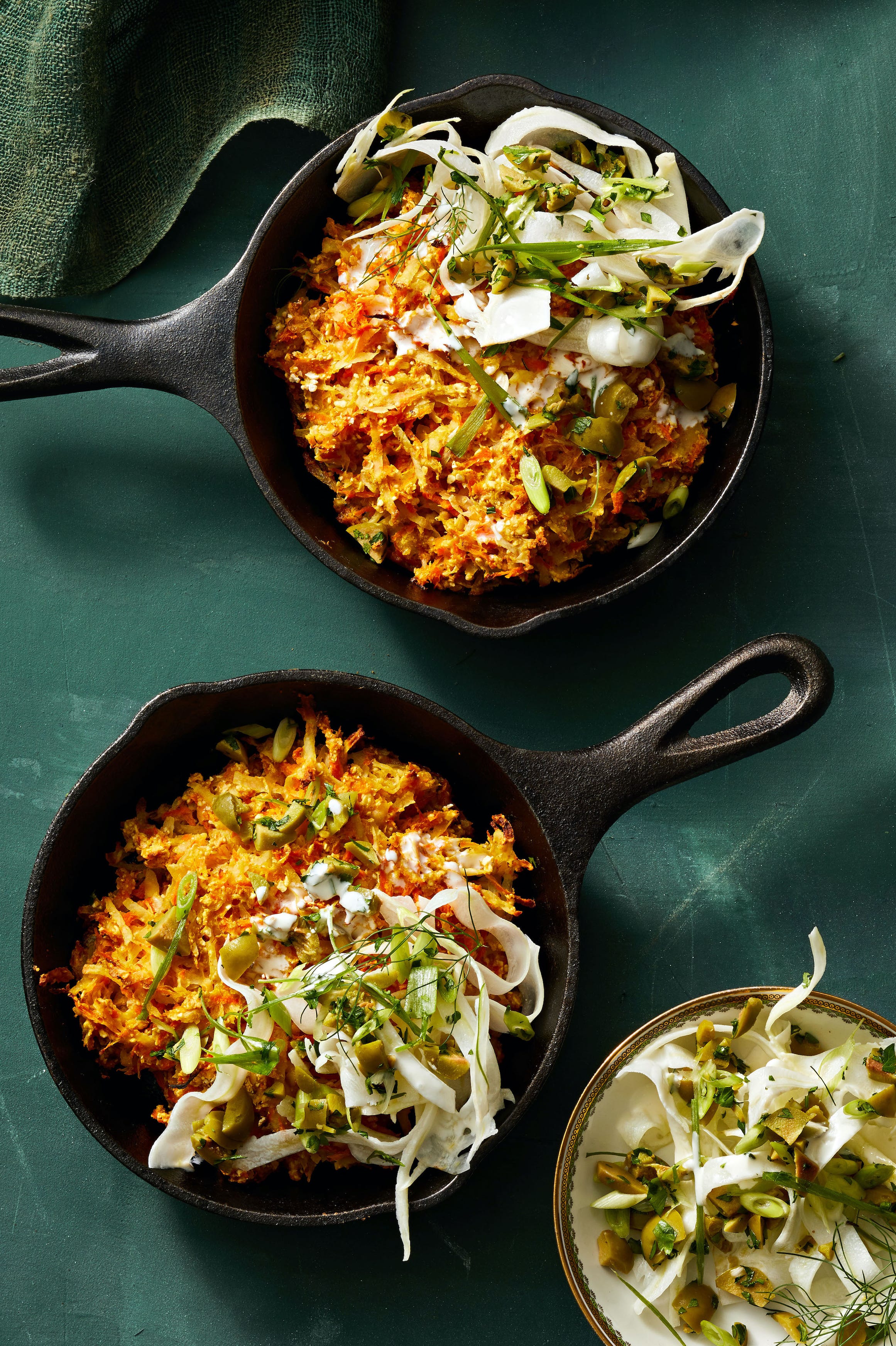 crispy carrot latkes in cast iron pans