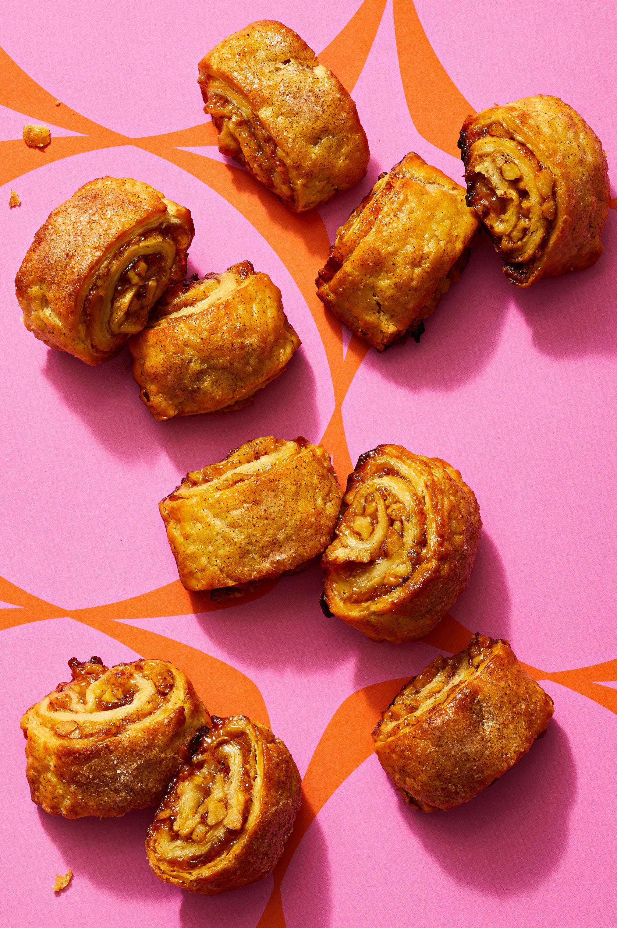 jammy walut rugelach on a pink background