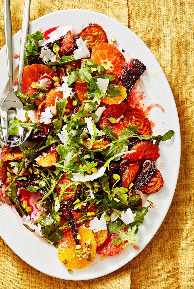 beet and orange salad on a white plate