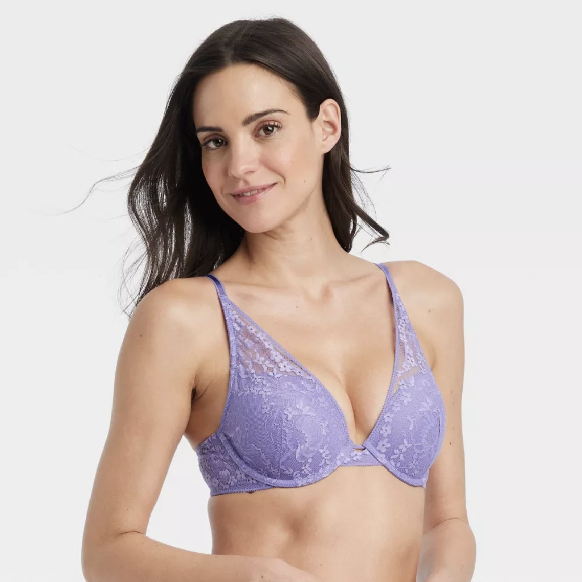 A model showcases a purple lacy bralette