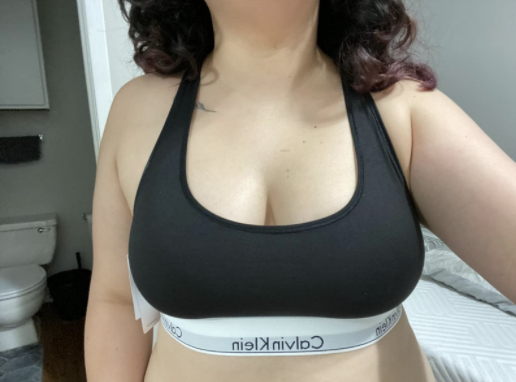 Reviewer wearing black bra