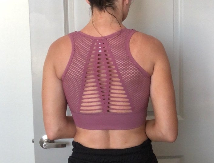 A reviewer wearing the bra from behind showing off the back 