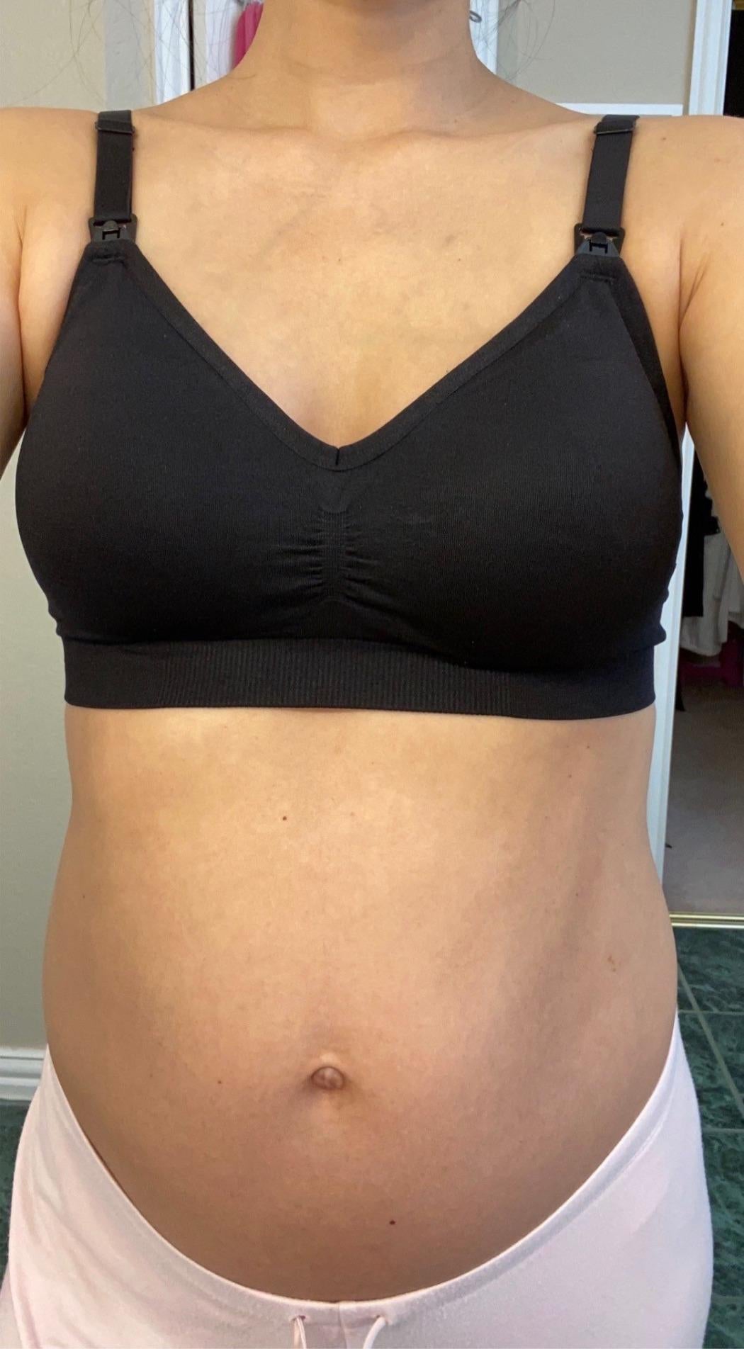 Person wearing a black nursing bra with adjustable straps