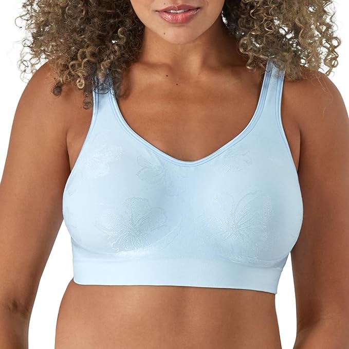 Person wearing a seamless bra with a subtle floral pattern in light blue 