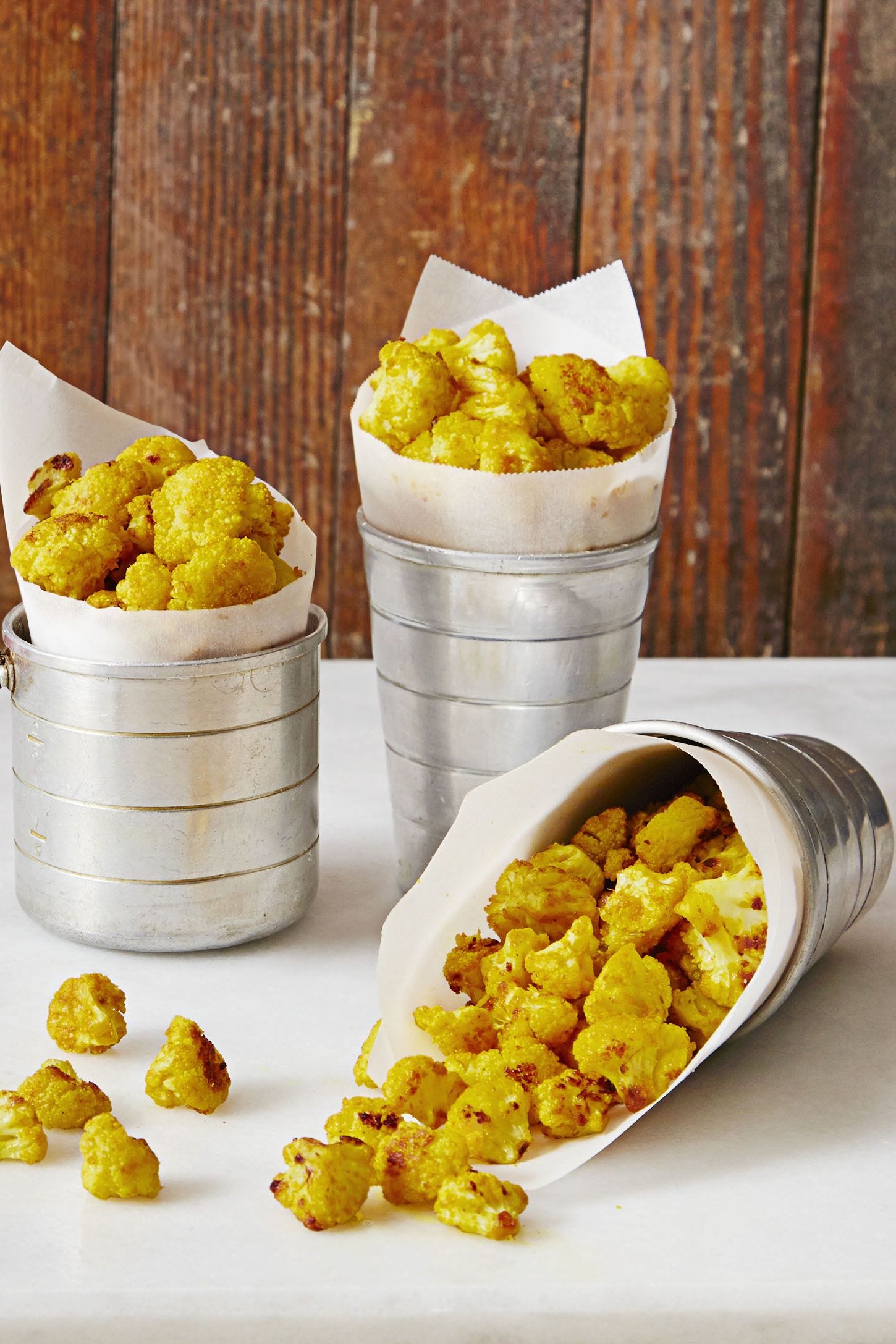 cauliflower popcorn in a metal cup