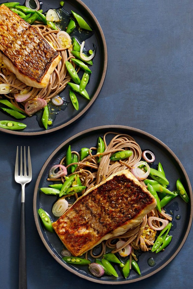 crispy striped bass with soba noodles on a plate