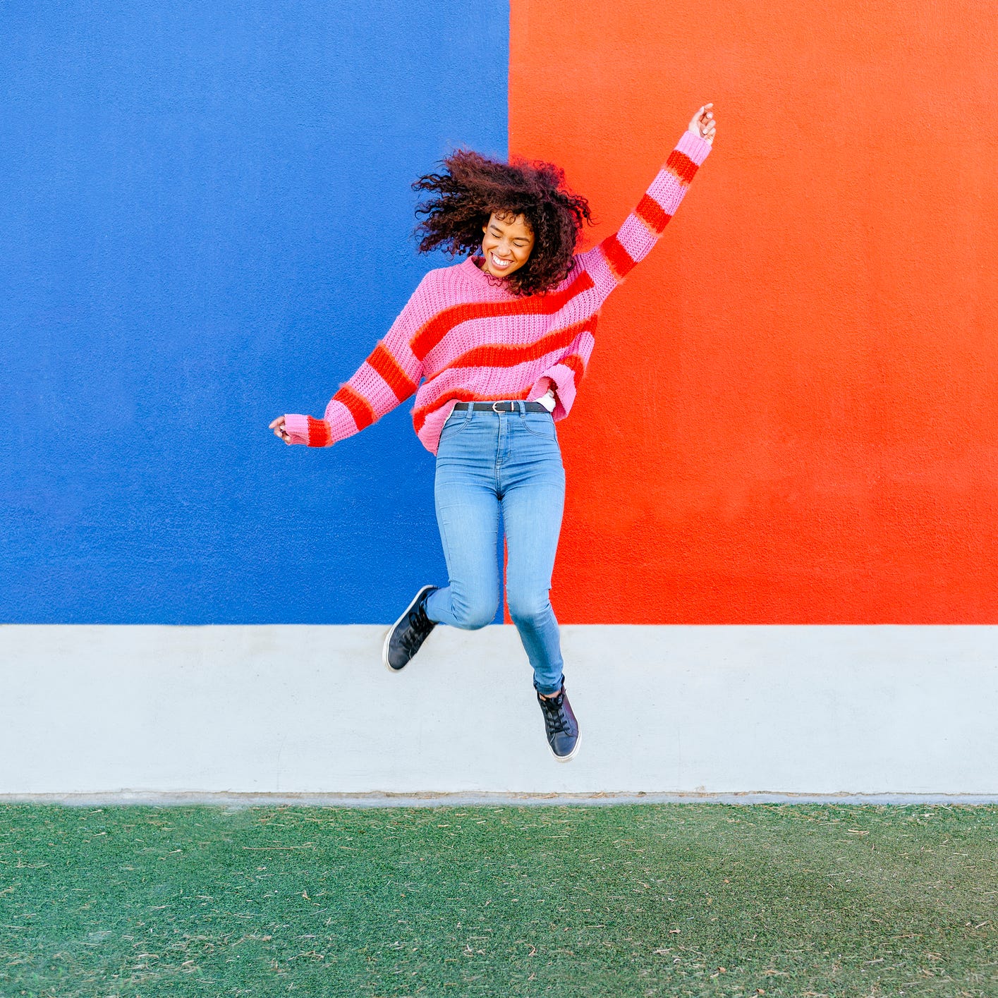 happy young woman jumping in the air