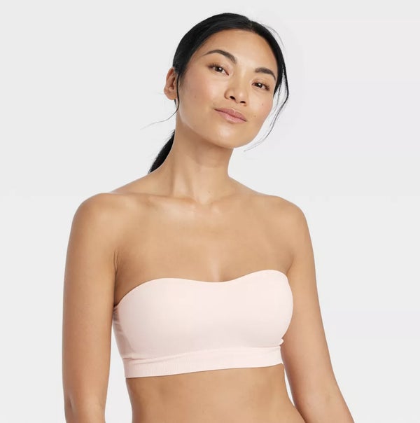 model wearing a light pink bandeau bra