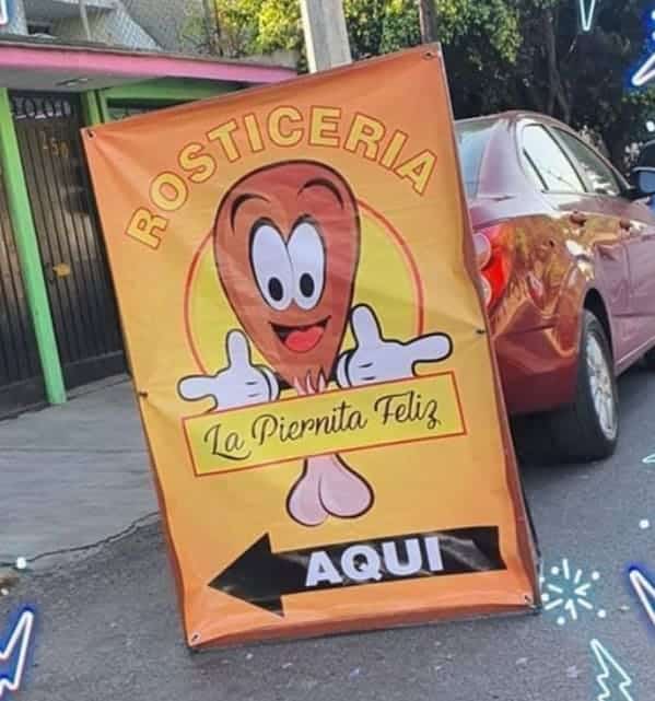 Chicken leg mascot on rotisserie sign appears inappropriate due to cartoon design resembling male anatomy