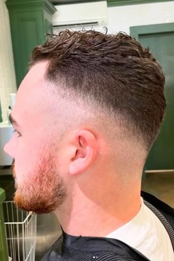 Textured Crop with Low Fade Men's Haircut, side view.