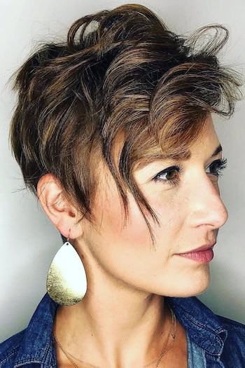 Tousled Layered Pixie Hairstyle on an older woman with short layered brown hair.