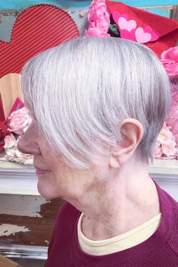 Silver Pixie with Long Side-Swept Bangs Haircut, side view.