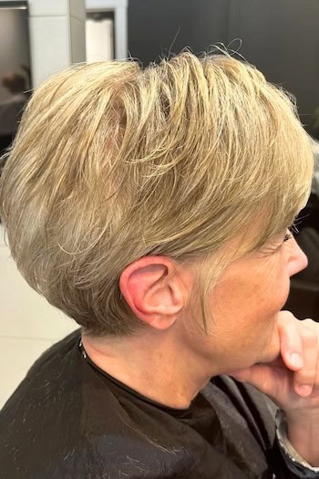 Golden Blonde Pixie with Lifted Crown Haircut, side view.