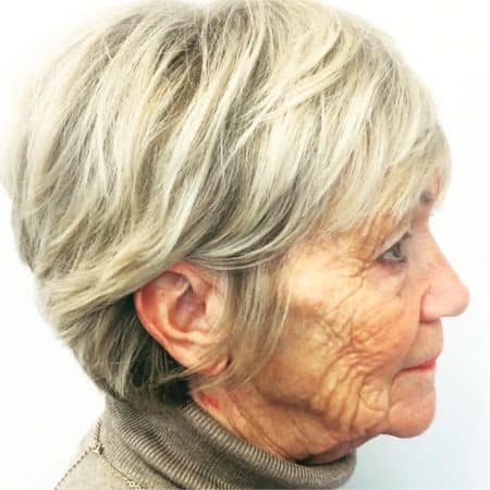 Silver Blonde Layered Pixie Haircut, side view.