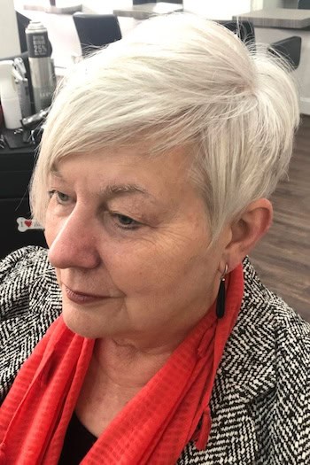 Platinum Pixie with Side-Swept Bangs Haircut