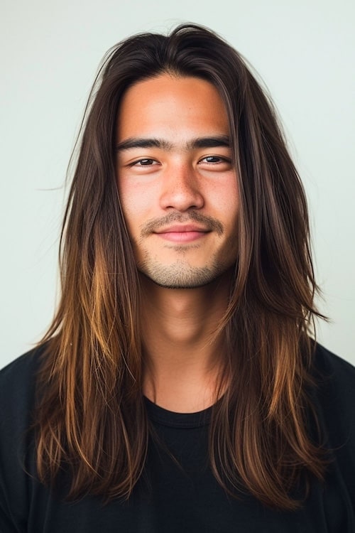 Long layers with center part on young man.