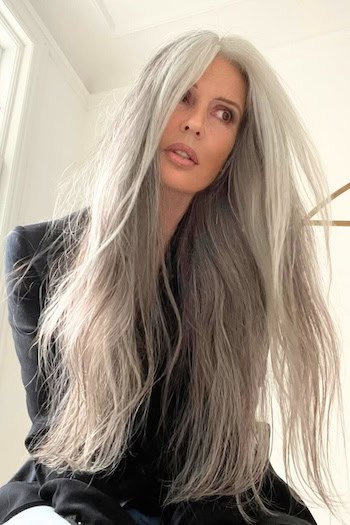 Long Silky Gray Hair Hairstyle on an older woman with very long gray hair.