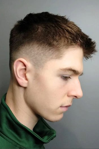 Short Textured Cut with Low Fade Men's Haircut, side view.