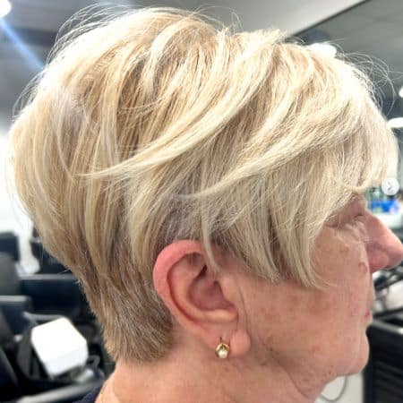 Blonde Pixie with Long Top Haircut, side view.