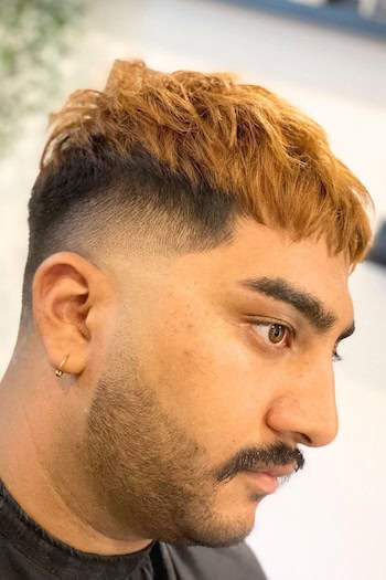 Edgar Cut with High Fade Men's Haircut, side view.