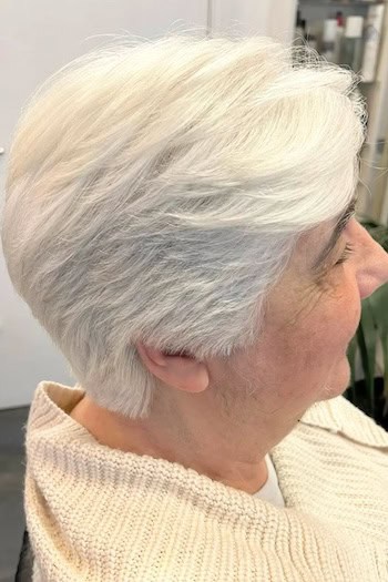 Silver-White Layered Feathered Pixie Haircut, side view.