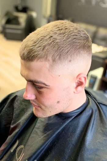 Short Textured Cut with Skin Fade Men's Haircut, side view.