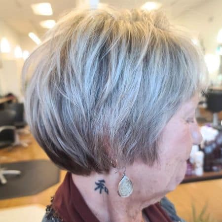 Layered Silver Pixie Wedge Cut Haircut, side view.