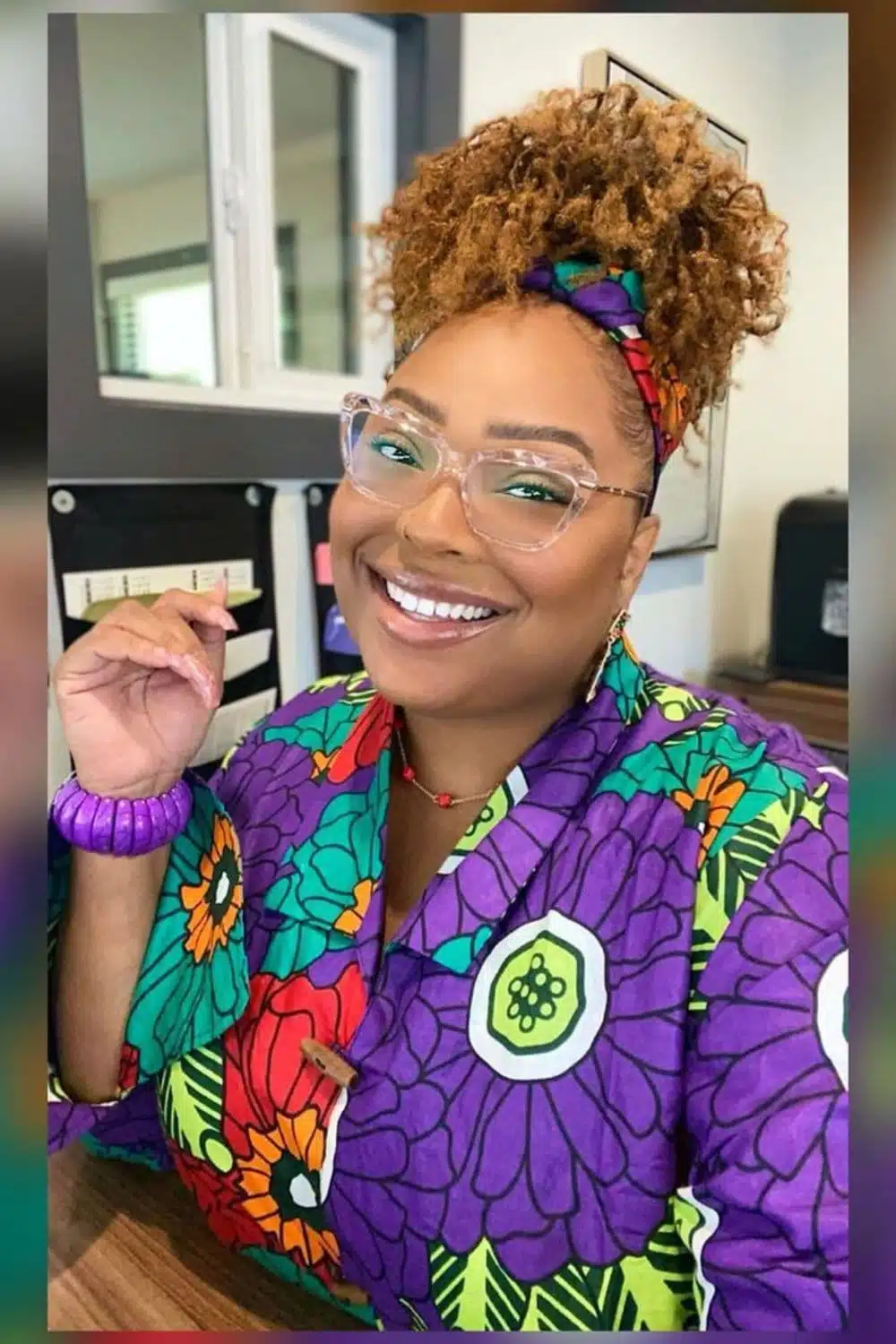 A woman with a blonde pineapple updo.